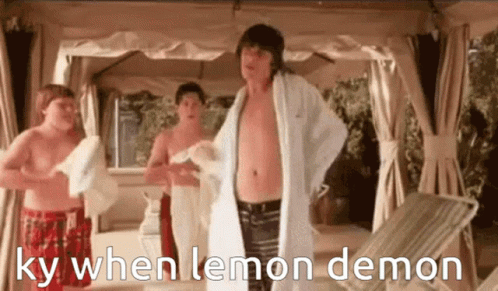 two guys in the bedroom with towels and the word,  when lemon demon