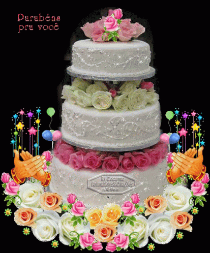 a white three tier cake with blue and purple flowers