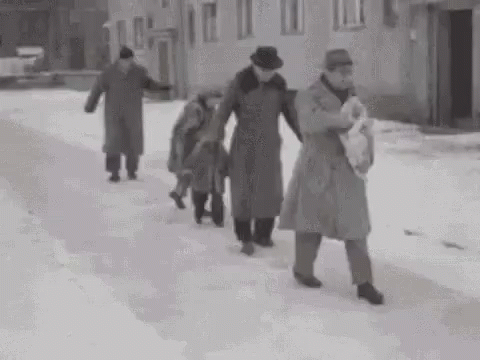 an old black and white po of women carrying their children