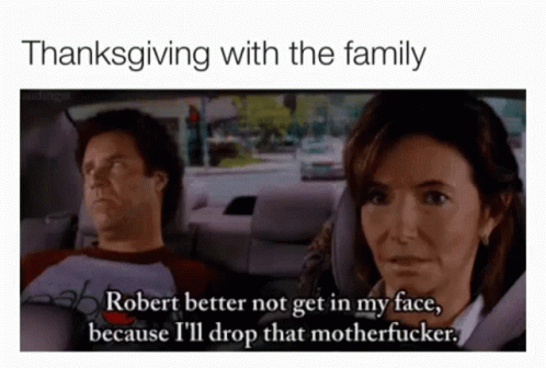a man and woman in a car one wearing a helmet and the other saying, thanksgiving with the family robert better not get in my face, because i'll