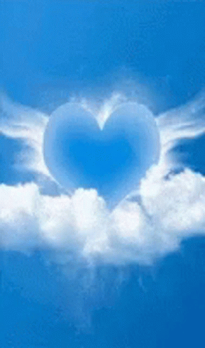 heart shaped cloud with flying white clouds in the sky