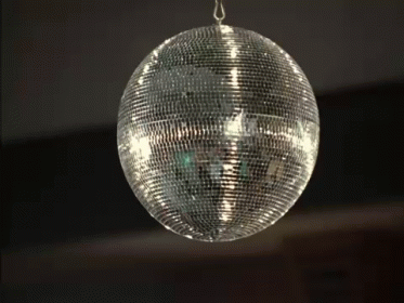 the disco ball is hanging from a rope