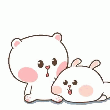 a couple of cute little stuffed animals on a white background