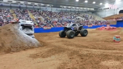 a truck and a four wheeler going around a curve