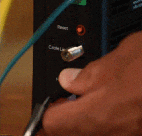 there is a blue hand that is plugging into an electrical device