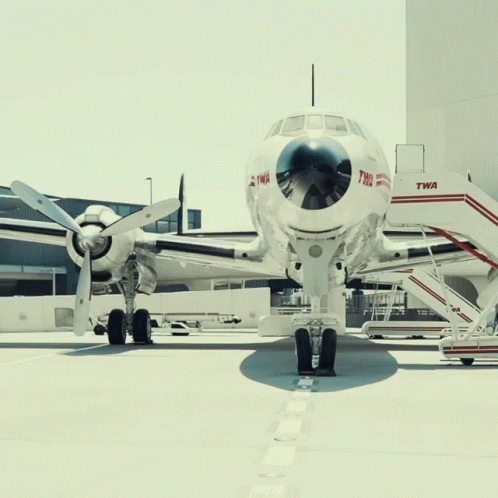 an airplane that is sitting in front of a building