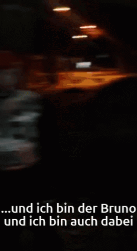 blurry pograph of a white van driving in the dark