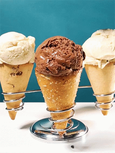 three scoops of ice cream in the shape of cones