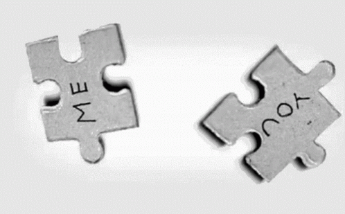 two pieces of metal jigsaw with words in them