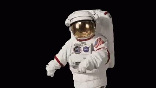 an astronaut walking through space in the dark