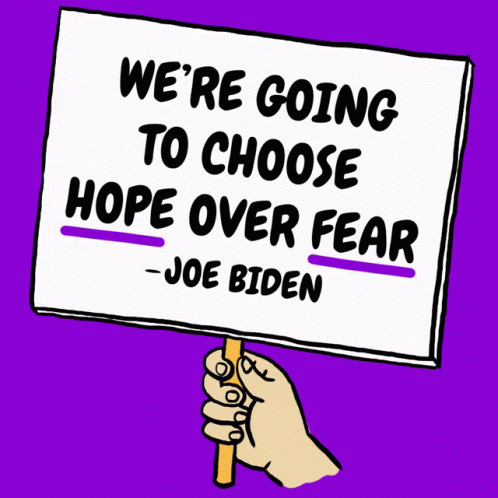 there is a hand holding a sign that says, we're going to choose hope over fear - joe biden
