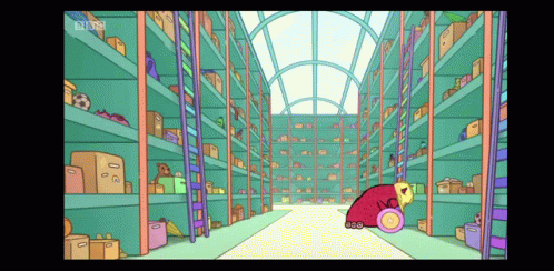 a person sitting inside a large room surrounded by shelves