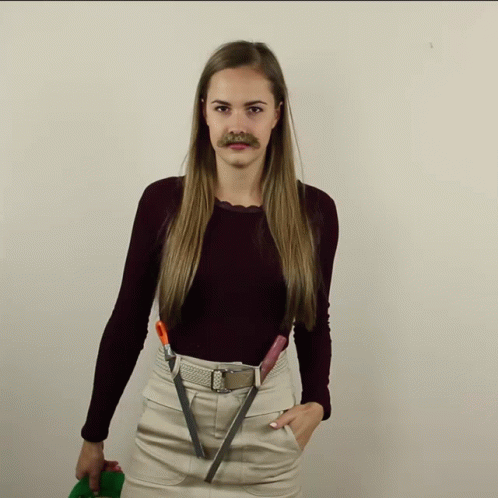 a woman with a moustache and makeup holding scissors