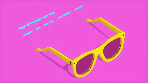a pair of blue glasses sitting on top of a pink background