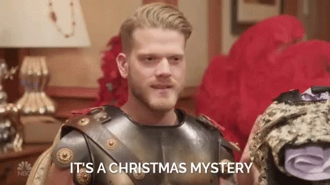 a man wearing a costume and talking to another person with words below it that says, its a christmas mystery