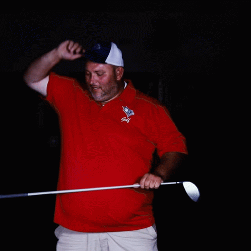 a man playing golf with his tee in hand