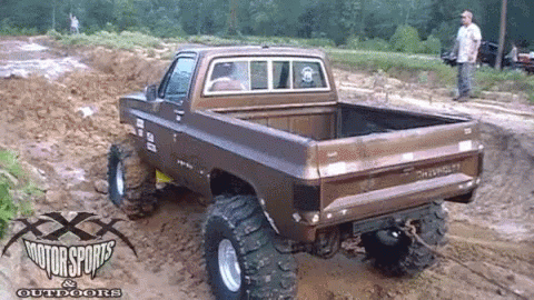 a large truck that is on some dirt