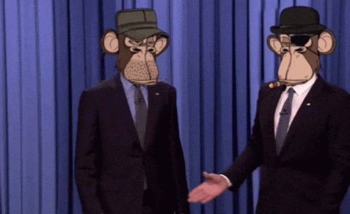 two men in suits are dressed as monkeys