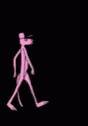 the man is walking alone with a hat and a cane
