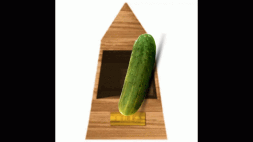 a pickle sitting on top of a blue triangular model