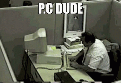 a man is at his computer desk working
