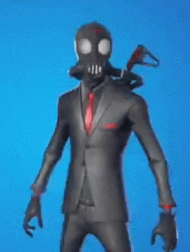 a man is wearing a suit and tie with a black mask on