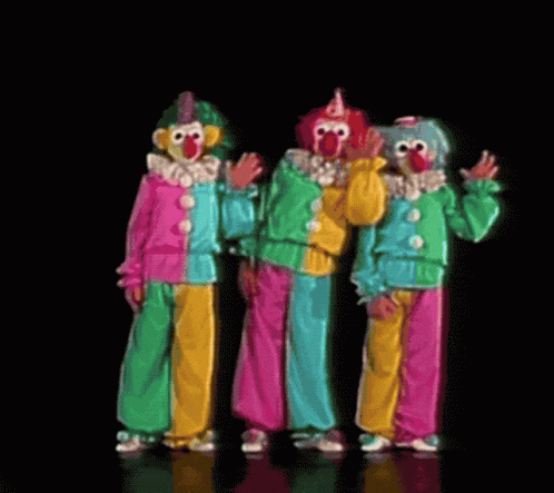 four colorful clowns stand in front of each other