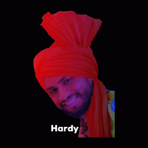 a po of a man smiling with his head wrapped in turban