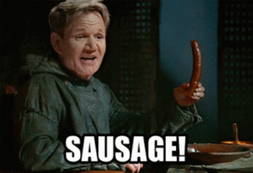 a man is holding up his right hand with a sausage sign below him