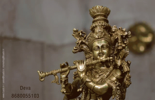 a statue of lord rama holding two arms