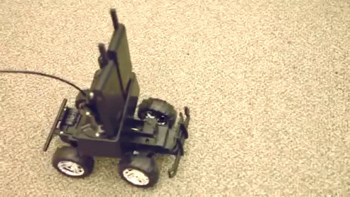 a toy truck with three wheels and one motor