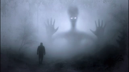 man in a foggy field is looking into a creepy image
