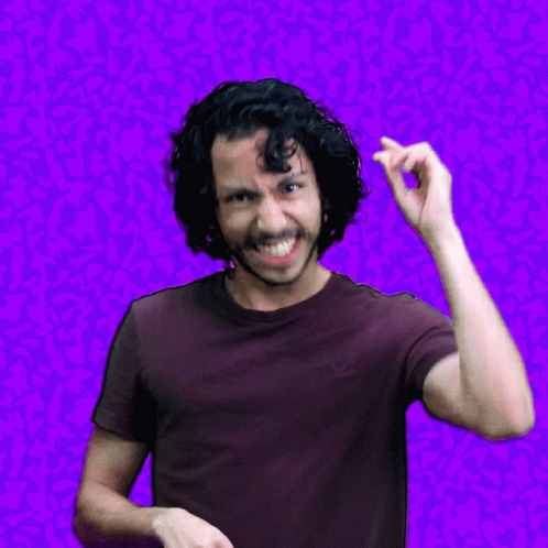 a person making a silly face with a pink background