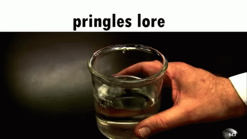 a man holding a glass with some liquid in it