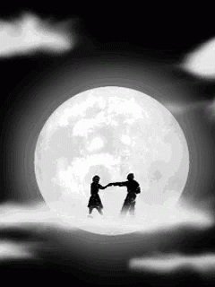 two people are shaking hands under the full moon
