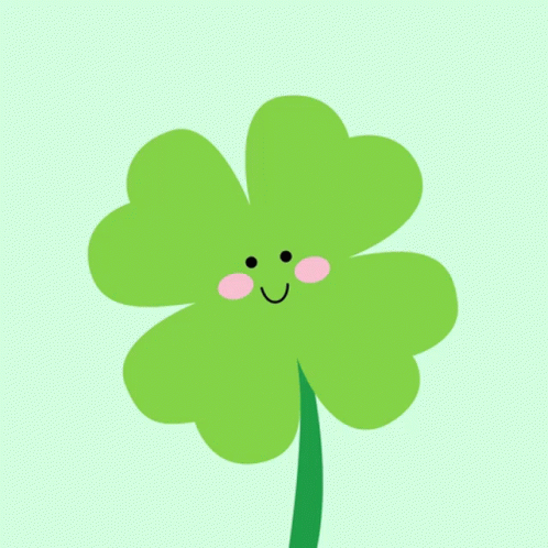 a green four leaf clover with happy eyes