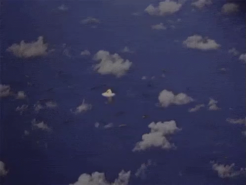 two pieces of plane paper are flying in the clouds