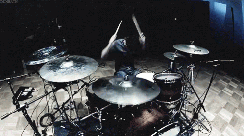 drummer on the drums and a set of cymbals