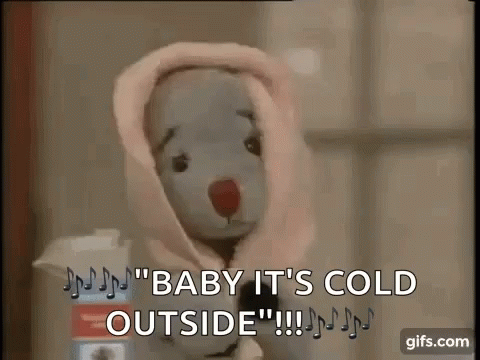 a teddy bear wearing a robe with the text baby it's cold outside