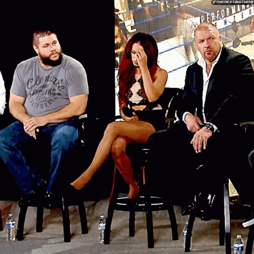 four people sitting on chairs at a panel
