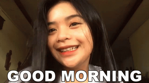 a girl smiling with words saying good morning