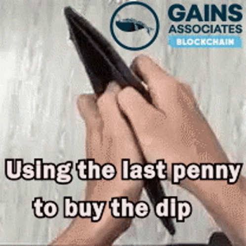 the hand is holding a pen with an ad that reads, using the last penny to buy