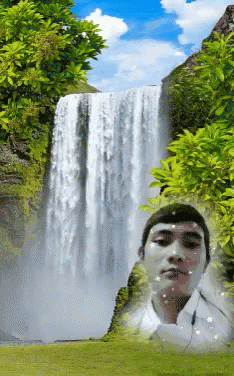 a man standing in front of a waterfall with his head underwater