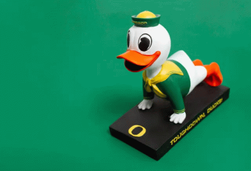 a ducky toy standing on top of a box