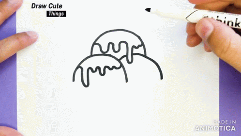 hands holding marker and drawing an ice cream picture on paper