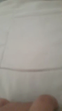 a blurry image of someones pillow on a bed
