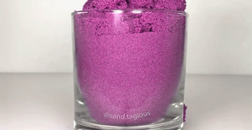 a glass with a purple substance in it