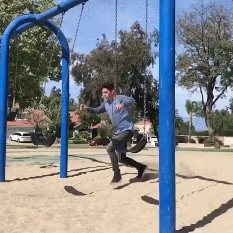 a man kicking a soccer ball into a hoop