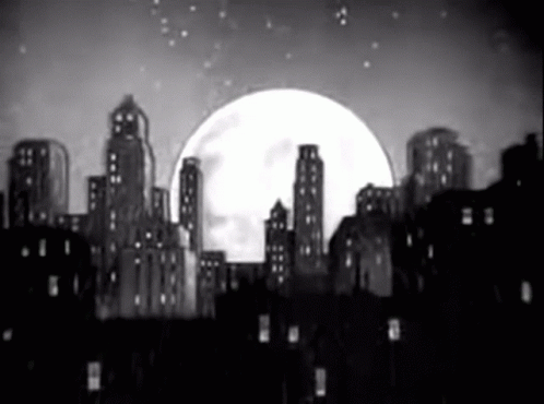 a large white moon with buildings in the background