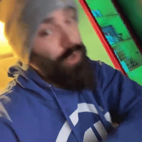 this is a blurry image of a man with a beard
